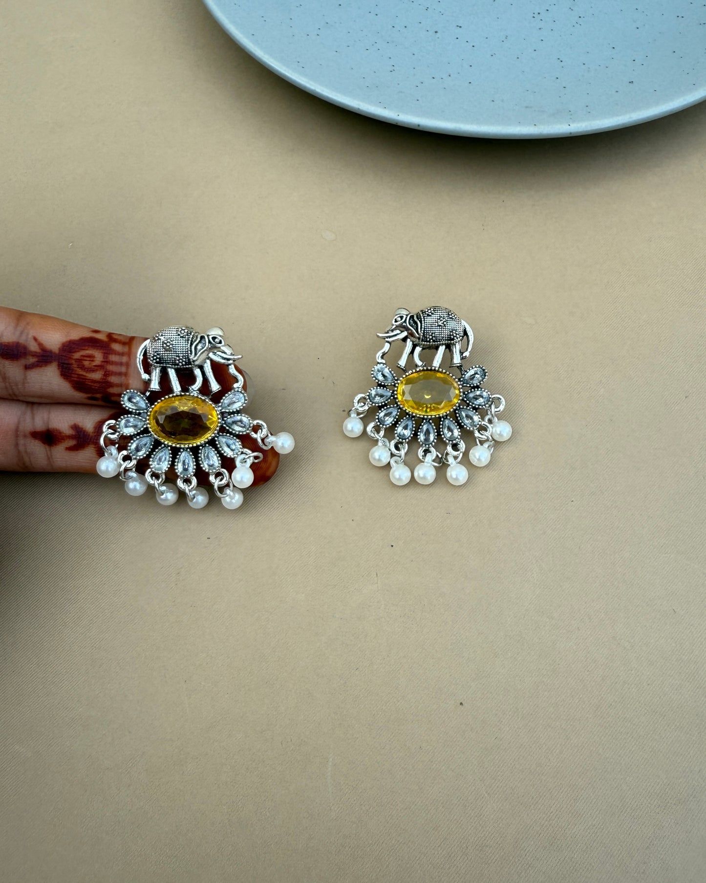 Iraa elephant theme yellow earrings